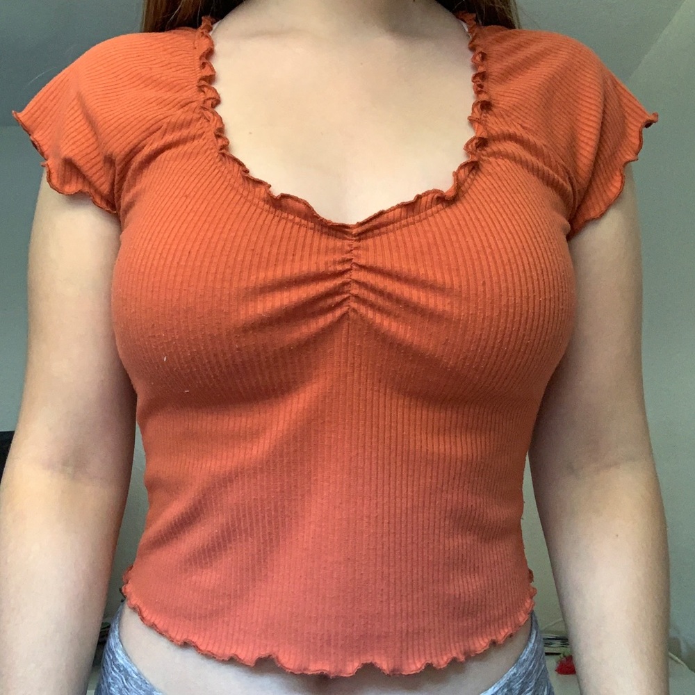 Orange lettuce edge crop top